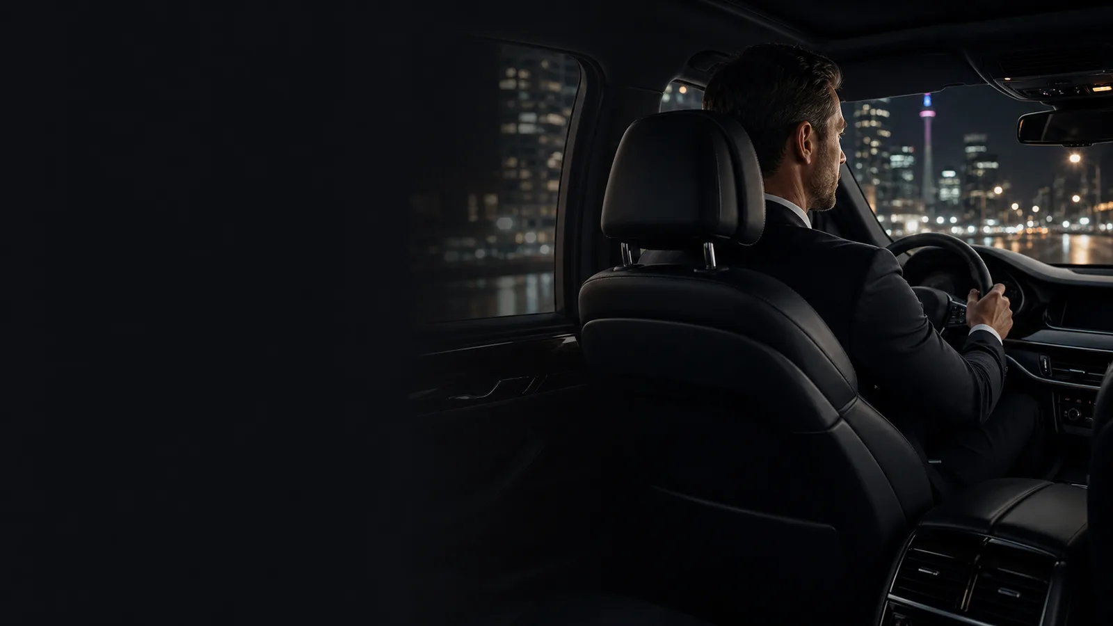LUX24 chauffeur driving an executive vehicle in Toronto at night